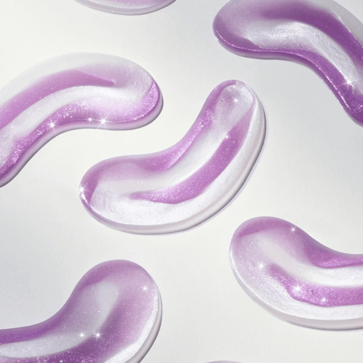 Purple-tinted hydrogel eye patches from 360° Shot PDRN Glowing Eye Patch, designed to provide radiance, hydration, and smoother skin under the eyes.