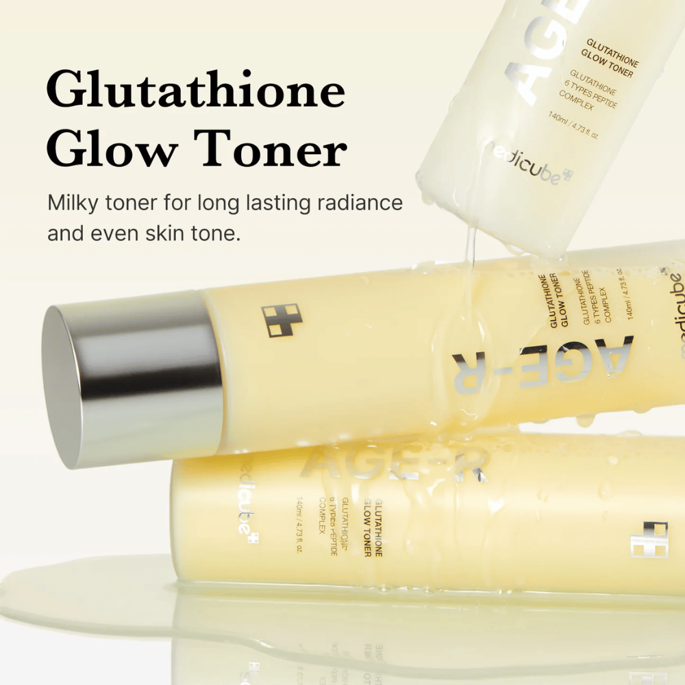 Medicube Age-R Glutathione Glow Toner is displayed in a yellow bottle. The product is described as a milky toner that provides long-lasting radiance and even skin tone. The toner contains glutathione and a peptide complex to enhance the appearance and texture of the skin.