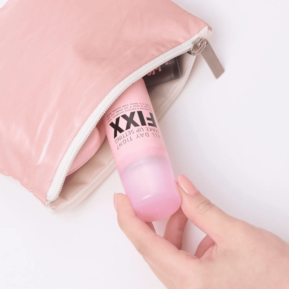 4. So Natural All Day Tight Make Up Setting Fixx – compact pink makeup setting spray that fits in a toiletry bag