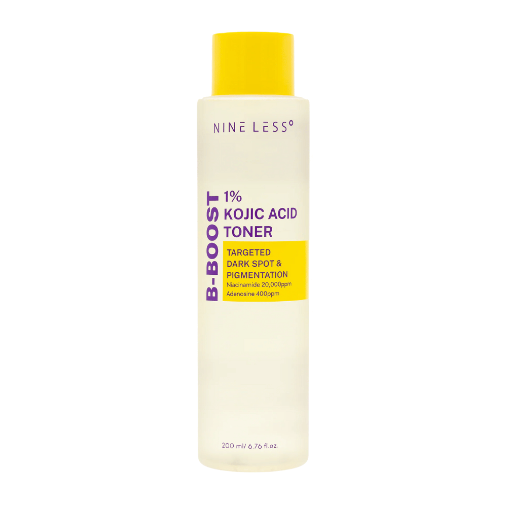 Product image of NINE LESS B-Boost 1% Kojic Acid Toner, a light yellow bottle with a yellow cap and purple text. Toner with kojic acid and niacinamide that reduces pigmentation spots.