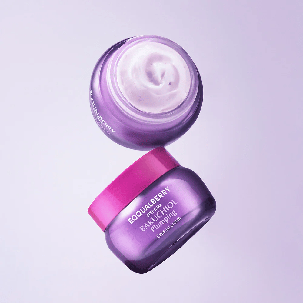 Two open jars of EQQUALBERRY Bakuchiol Plumping Capsule Cream in purple packaging with pink lids. The cream's soft texture is clearly visible from above.