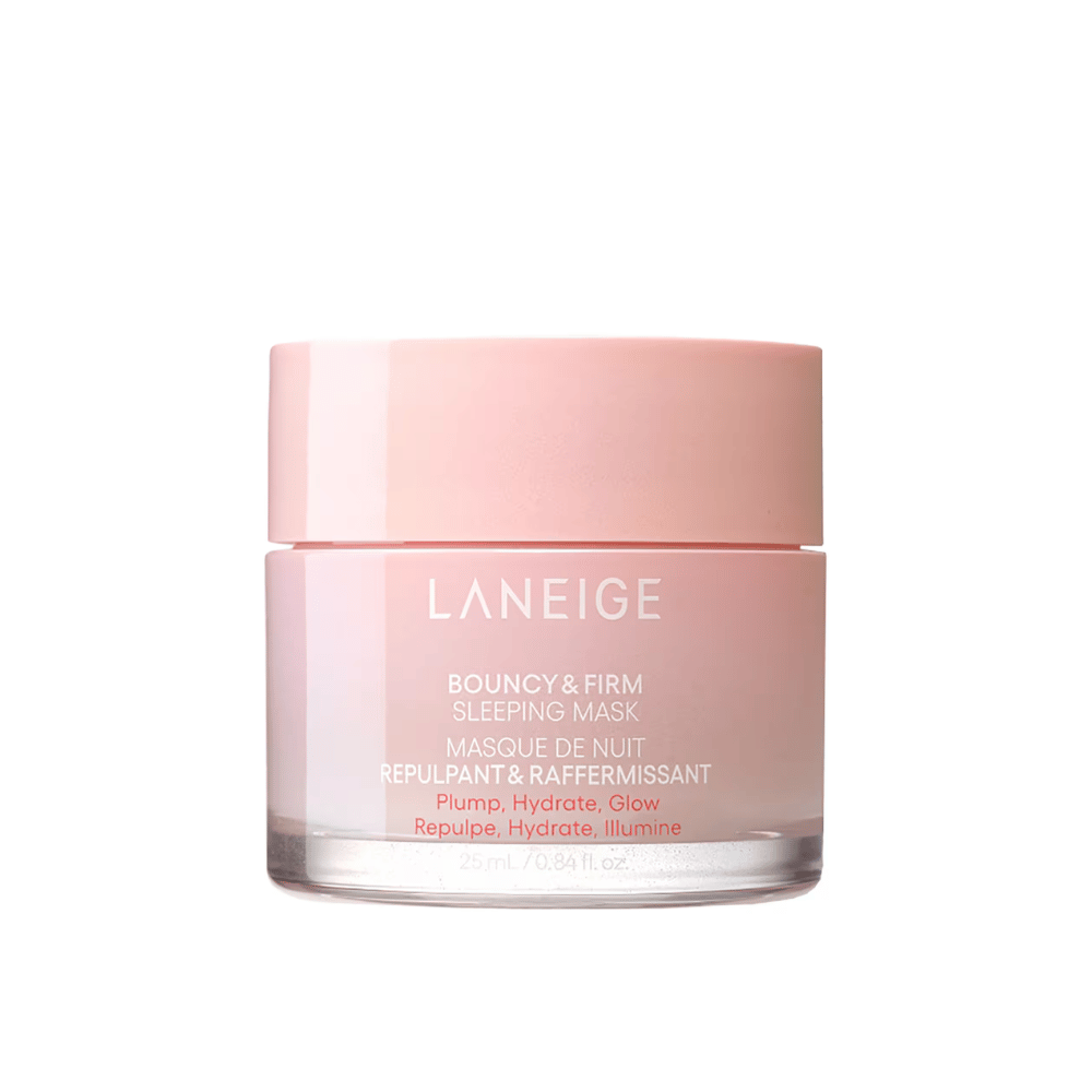 Laneige Bouncy & Firm Sleeping Mask in a pink glass jar with a matching lid. The product, which holds 25 ml, is designed to provide plumpness, hydration, and glow overnight. The text on the jar includes "Plump, Hydrate, Glow."