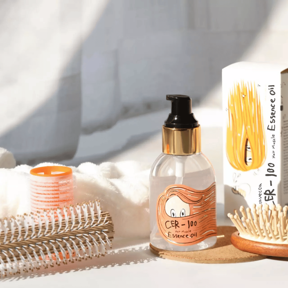 Elizavecca CER-100 Hair Muscle Essence Oil styling – moisturizing hair oil that helps reduce frizz, add shine, and protect hair during styling.