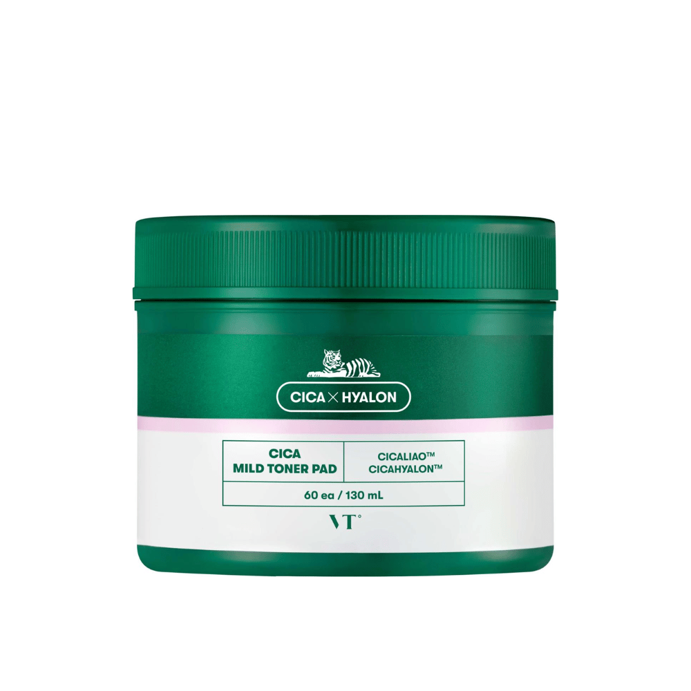 Green jar with VT Cica Mild Toner Pad, 60 pads/130 ml, with white and pink label and tiger logo against a white background.