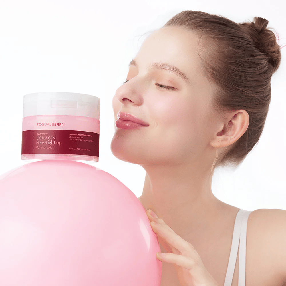 A woman stands with a pink ball and a jar Collagen Pore-Tight Up Gel Toner Pads, while smiling and holding the jar close to her face. The jar is labeled with the product's name and contains toner pads that help to firm the skin and reduce pore size.