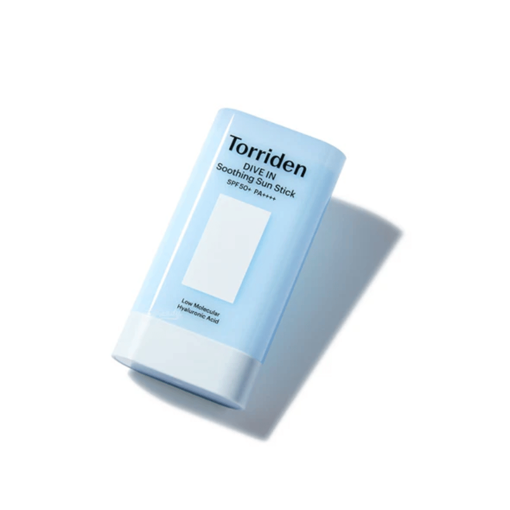 Torriden DIVE IN Soothing Sun Stick SPF50+ PA++++ photographed at an angle that highlights the compact and sleek design.