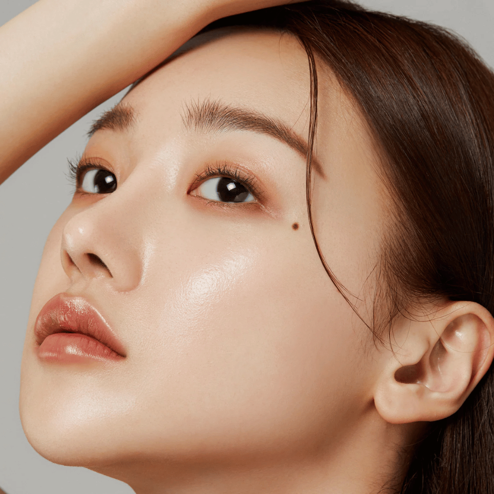 Close-up of glowing skin – the result of Medicube Deep Lifting Peptide Eye Cream which strengthens skin elasticity and hydrates.