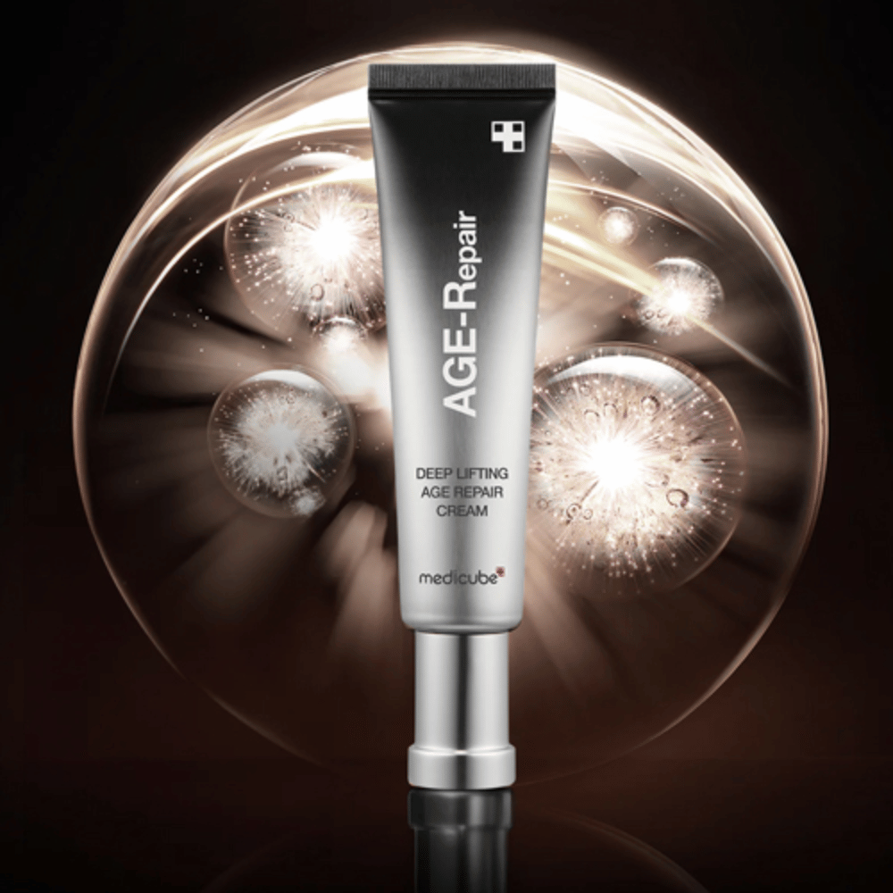Medicube Deep Lifting Age Repair Cream in silver tube against background with light effects, symbolizes anti-aging and skin renewal.
