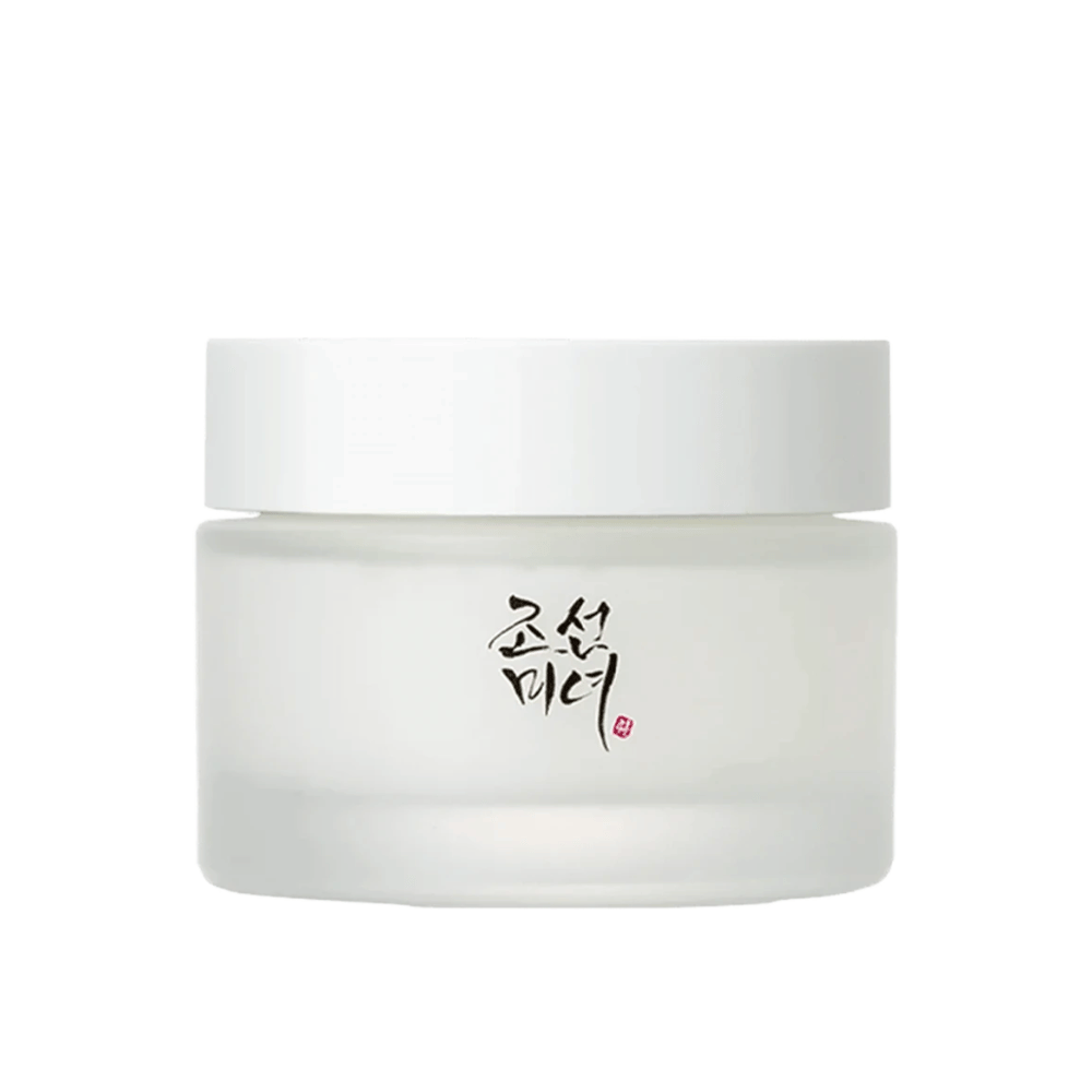 The image shows a jar "Beauty of Joseon Dynasty Cream". The packaging is in frosted glass with a simple white lid, elegantly decorated with traditional Korean calligraphy in black. The product is intended to offer nourishing skincare inspired by ancient Korean beauty routines.