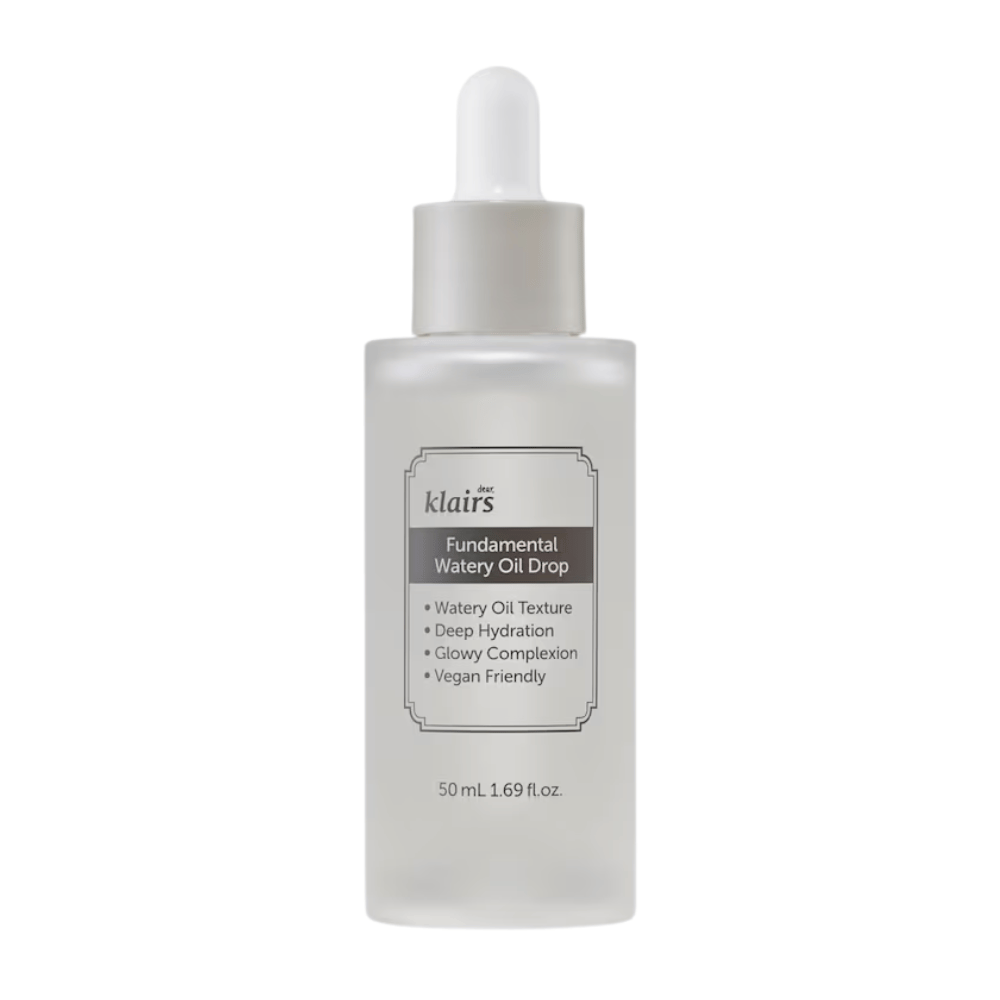 Transparent bottle with dropper containing Klairs Fundamental Watery Oil Drop, 50 ml. The label describes the product's properties as deep hydration, glowing effect, and vegan formulation.