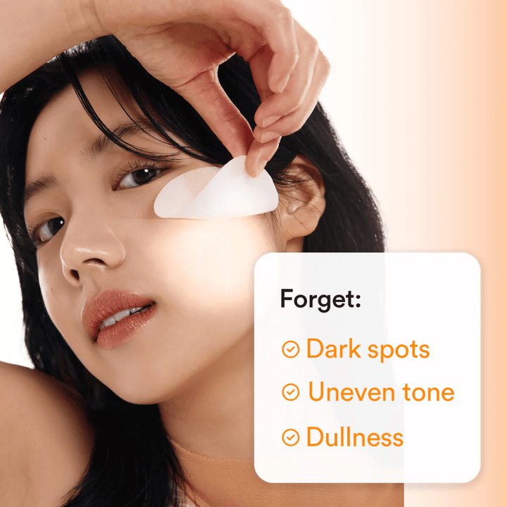 Woman applying a toner pad under the eye to counteract dark spots and dull skin.