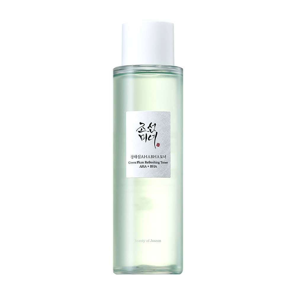 The bottle of "Green Plum Refreshing Toner" AHA + BHA has an elegant design with a white cap and transparent body that shows the green liquid inside. The label has a sleek black and red text, giving a fresh and modern feel.