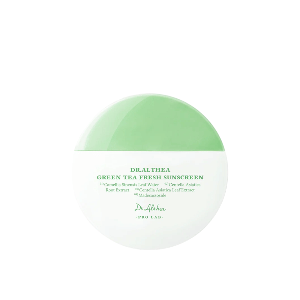 Round sunscreen from Dr. Althea with green-white packaging and text highlighting ingredients like green tea and centella asiatica – a mild chemical sunscreen with soothing properties.