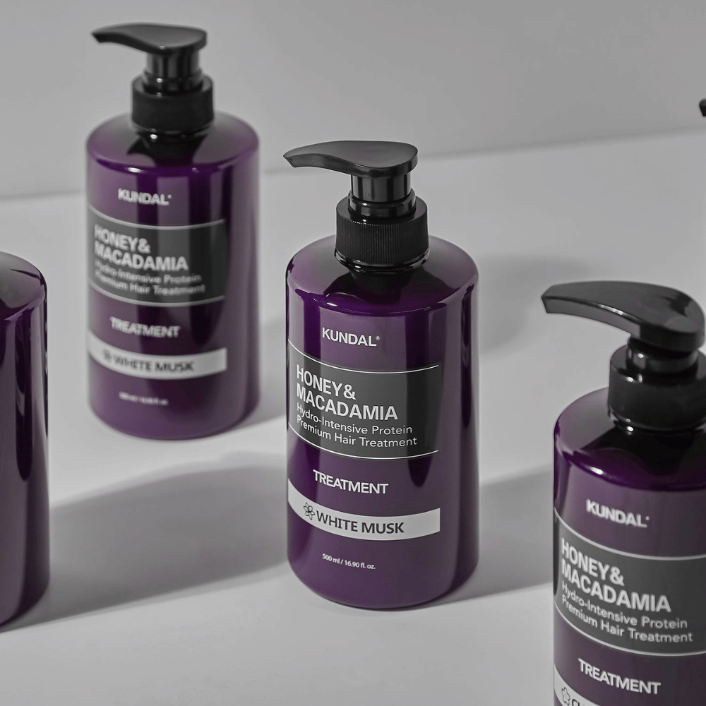 KUNDAL Honey & Macadamia Hydro-Intensive Protein Premium Hair Treatment White Musk, 500 ml, in purple pump bottle.