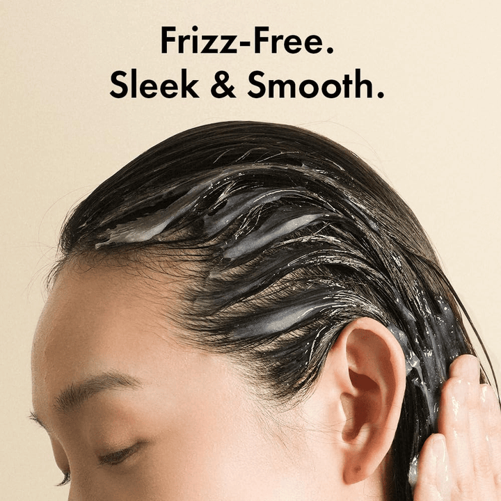 Person applying Grabity Hair Lifting Water Conditioner to wet hair. The lightweight formula coats the hair strands to reduce frizz and leave hair softer, smoother, and more well-cared-for.