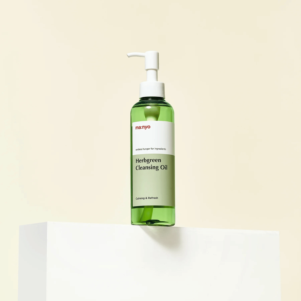 ma:nyo Herbgreen Cleansing Oil standing on pedestal, mild Korean cleansing oil with green herb extracts for daily face wash