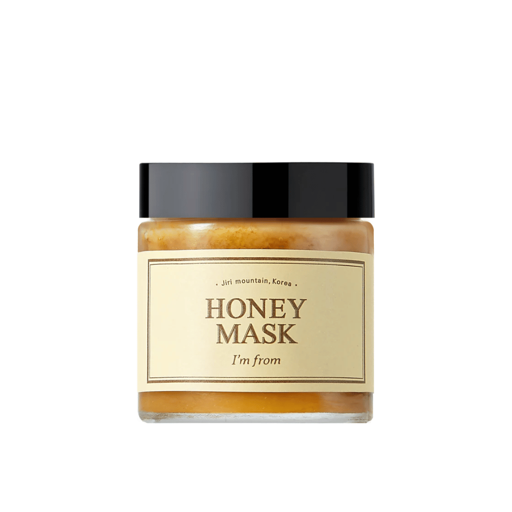  A jar "I'm from Honey Mask", with natural honey content, against a white background.