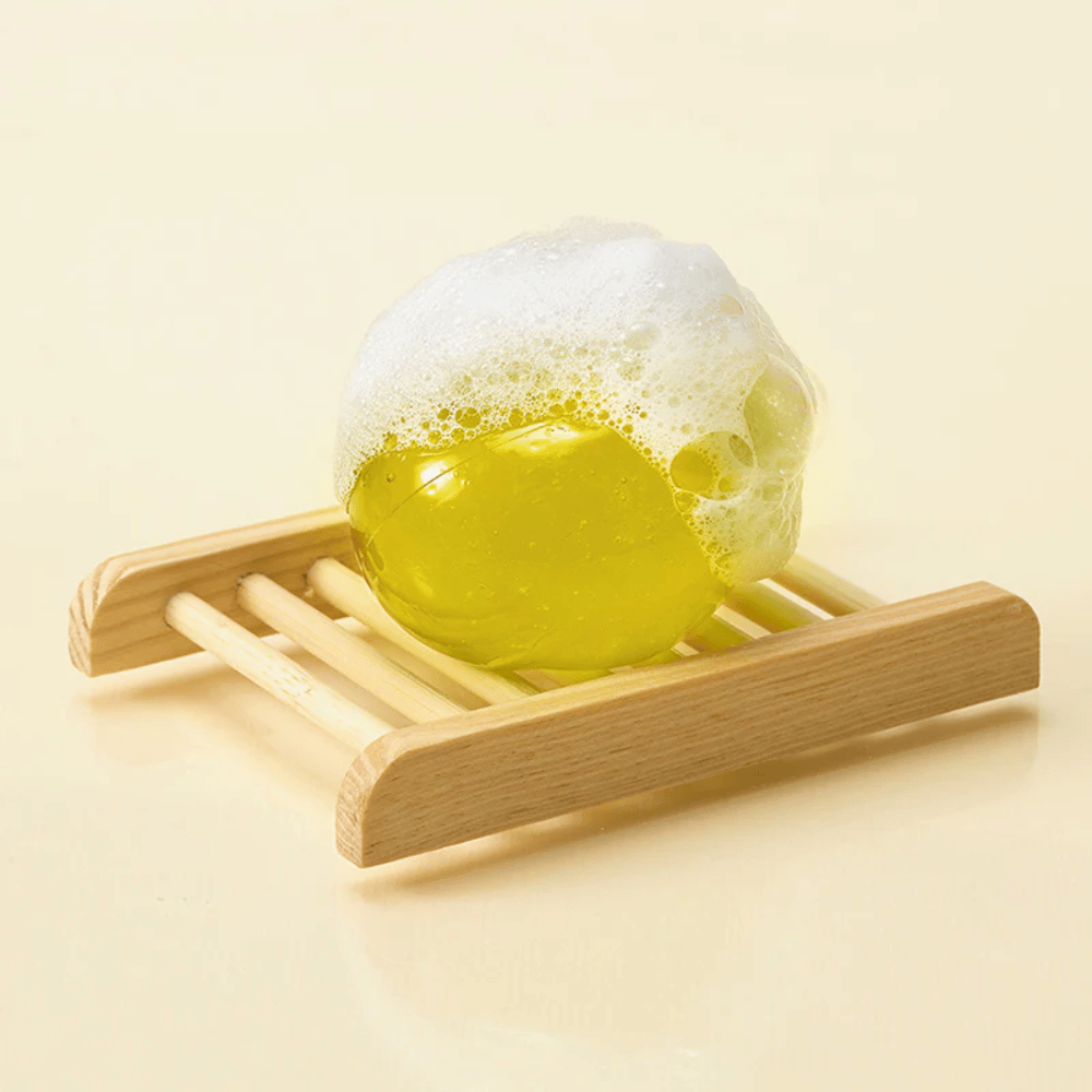 Foaming Ongredients Jeju Cica Cleansing Ball on soap dish – mild cleanser that strengthens the skin barrier and reduces irritation.
