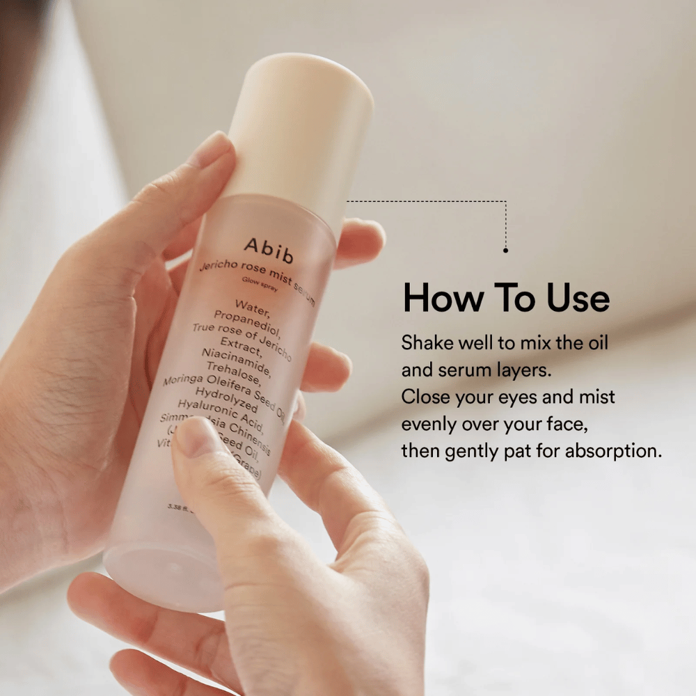 Person holds Abib Jericho Rose Mist Serum and shows how to shake the bottle to mix the oil and serum before use.