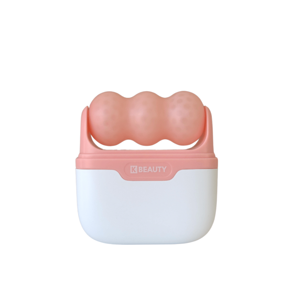 The image shows a K-Beauty Ice Roller with a white and pink handle. The product has three rounded, dotted rollers in pink color on the top, designed to cool and massage the face. The background is completely white.