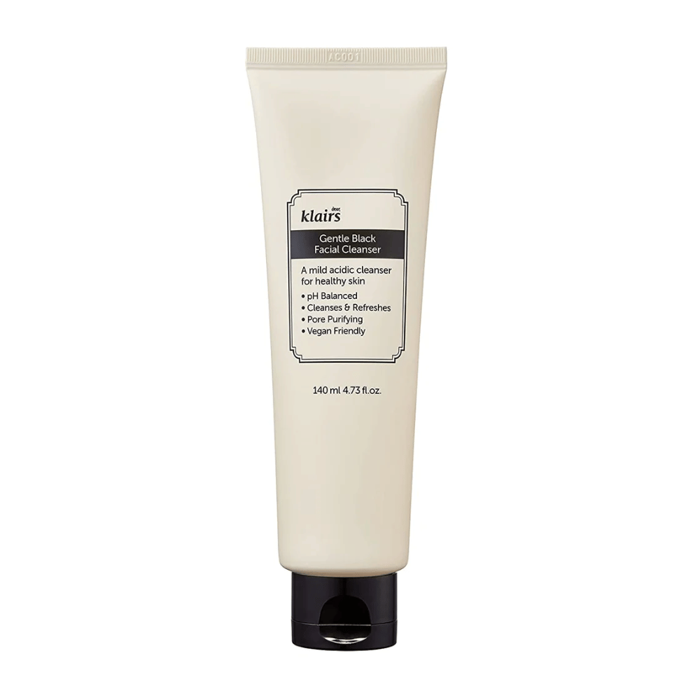 A tube of Klairs Gentle Black Facial Cleanser with a black cap and text about properties, such as mild and pH-balanced, on a clean white background.