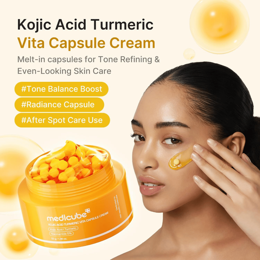 4. Medicube Kojic Acid Turmeric Vita Capsule Cream – radiance-boosting face cream with capsules applied to the cheek