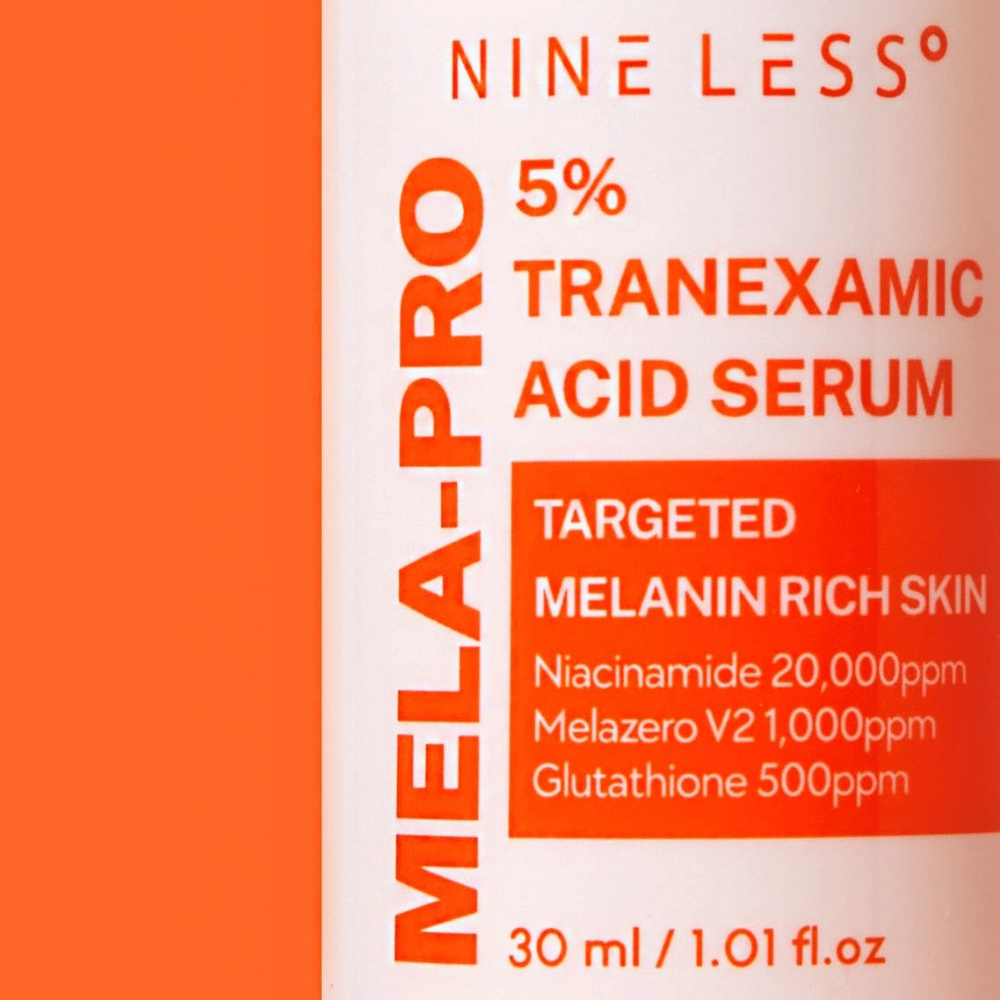 Close-up of NINE LESS MELA-PRO 5% Tranexamic Acid Serum with 5% tranexamic acid, niacinamide, and glutathione.