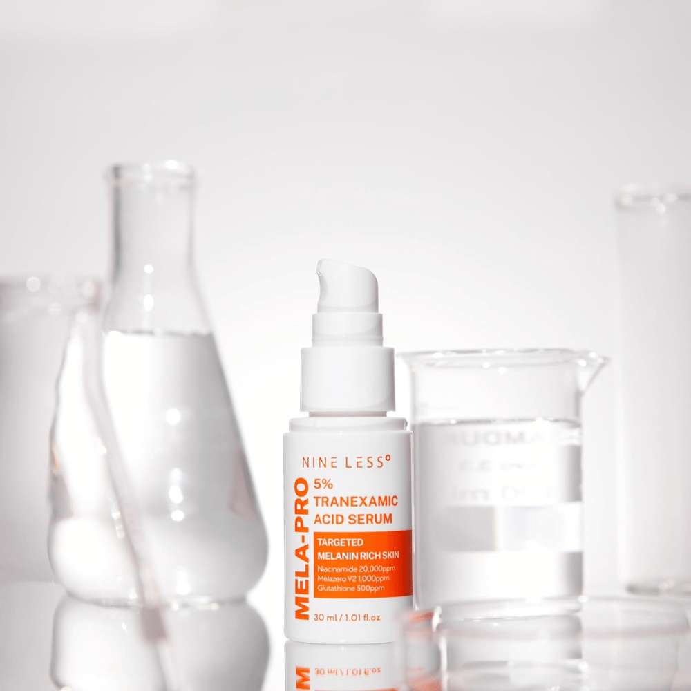 NINE LESS MELA-PRO 5% Tranexamic Acid Serum with tranexamic acid and niacinamide, smoothing facial serum for clearer skin.