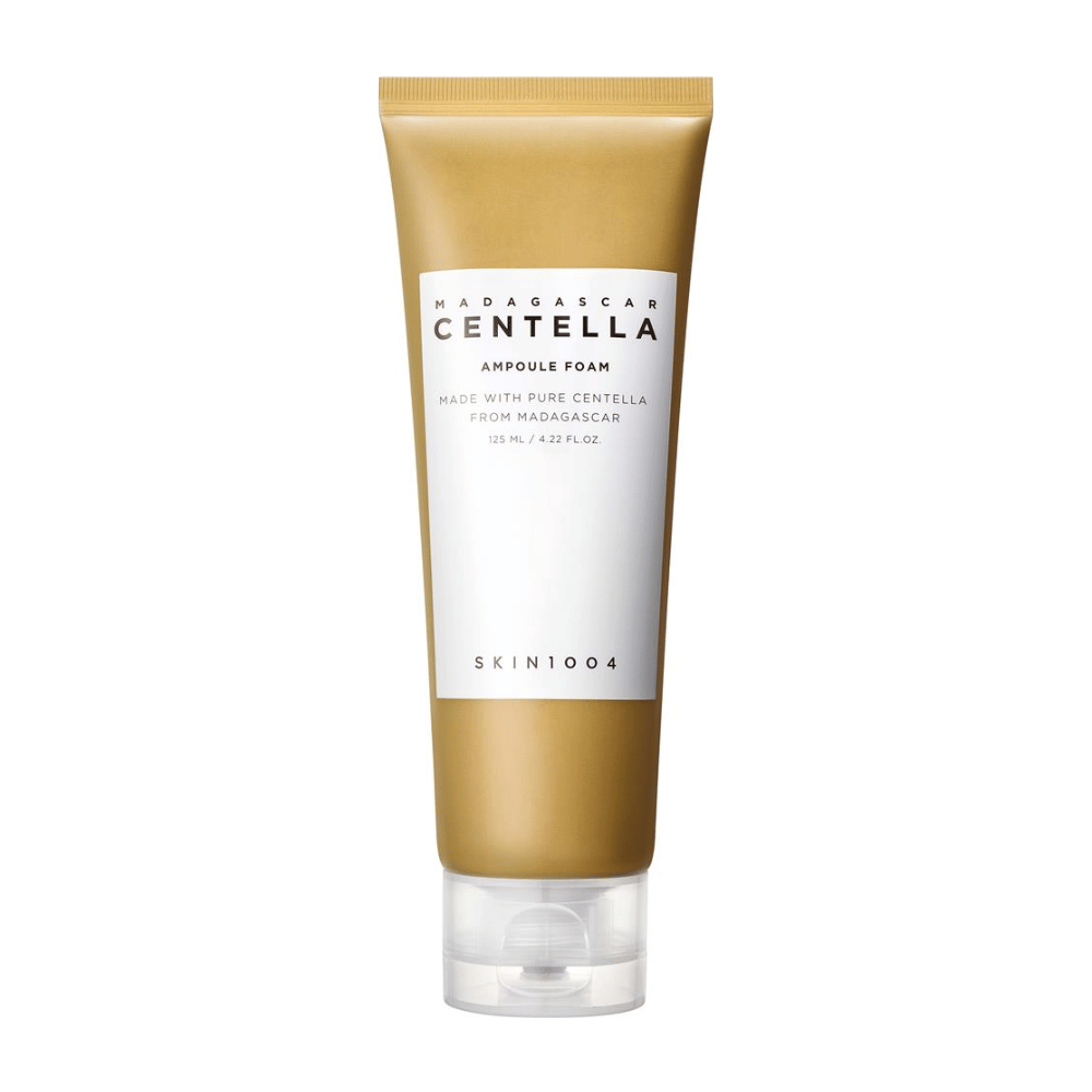 The image shows a tube of "Madagascar Centella Ampoule Foam" from the brand SKIN1004. It is a facial cleansing product that contains 125 ml / 4.22 fl.oz. The formula is based on pure Centella extracted from plants in Madagascar. The product is designed to gently cleanse and care for the skin.