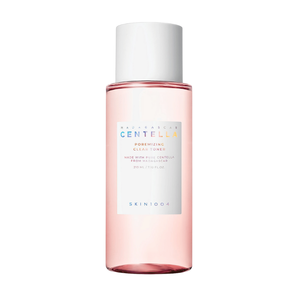 A bottle with Madagascar Centella Poremizing Clear Toner, which is transparent with a pink hue. The product has a white cap and label with the text "Poremizing Clear Toner" and "Made with Pure Centella from Madagascar." The bottle holds 210 ml and gives a sense of freshness and skincare.