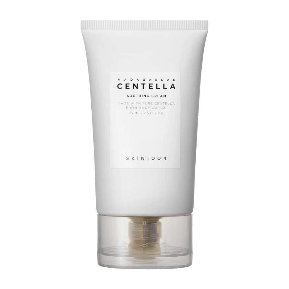 A white tube of Madagascar Centella Soothing Cream from SKIN1004 with a transparent cap. The text on the tube describes the product as soothing and made with pure Centella from Madagascar. The tube contains 75 ml / 2.53 fl. oz.