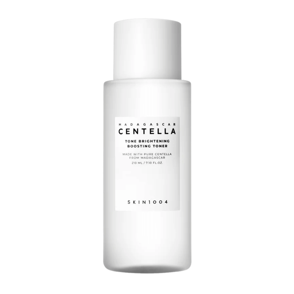 Product image of SKIN1004 Madagascar Centella Tone Brightening Boosting Toner – a white, elegant bottle with a minimalist design and black text.