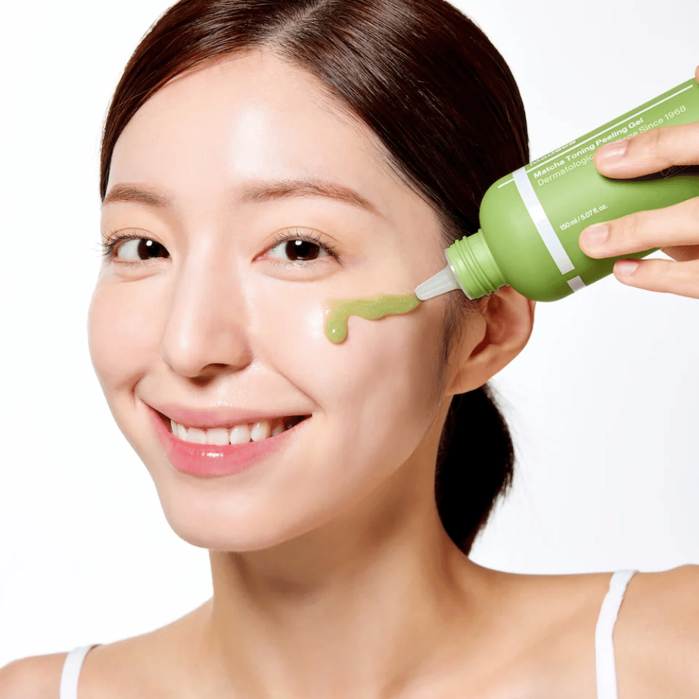 Person applying Centellian24 Madeca Matcha Toning Peeling Gel – mild exfoliator that helps remove dead skin cells and make the skin softer and more radiant.