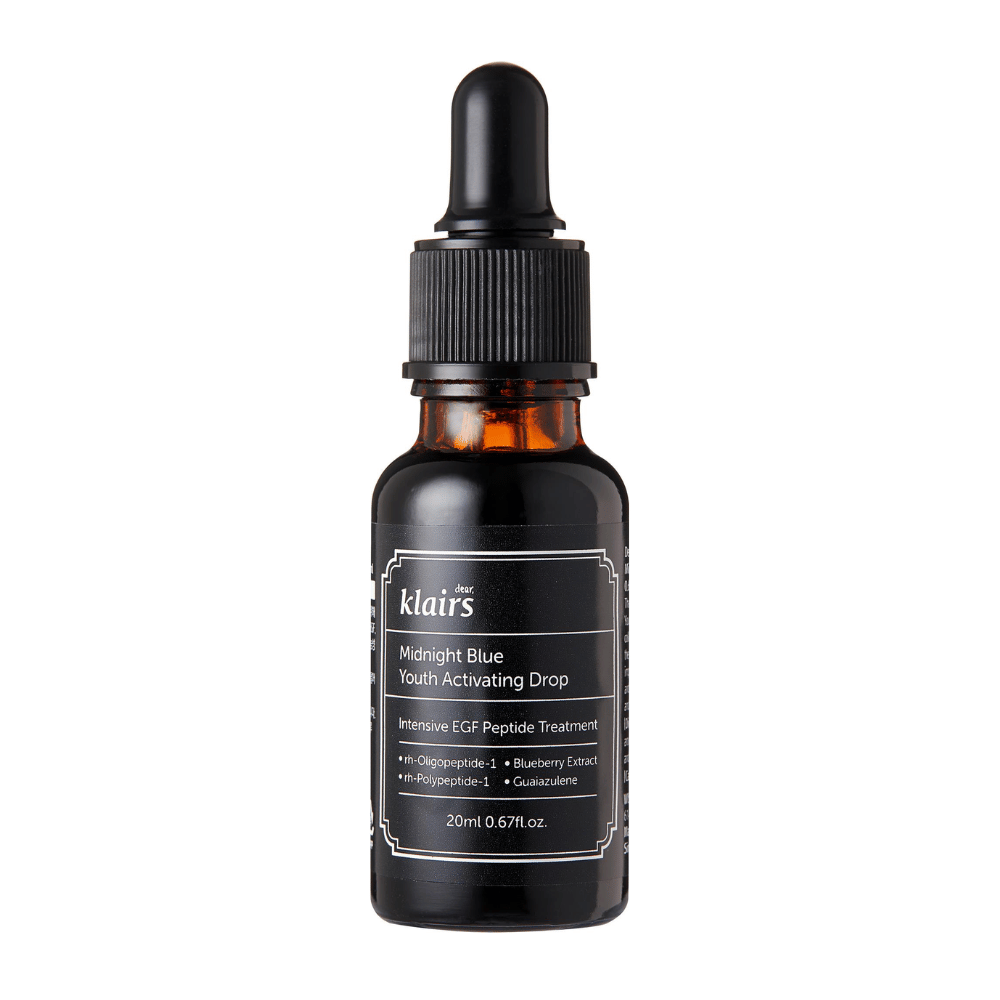 Klairs Midnight Blue Youth Activating Drop in a dark glass bottle with a dropper. The product contains EGF peptides, blueberry extract, and guaiazulene to promote skin elasticity and counteract signs of aging.