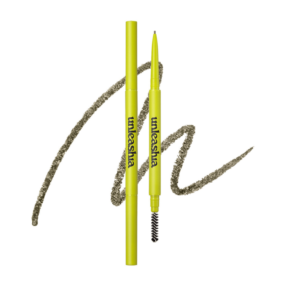 The image shows UNLEASHIA's eyebrow pencil in the color "N°1 Oatmeal Brown". The product has a light green packaging and consists of a pencil tip and a brush to shape and define the eyebrows.