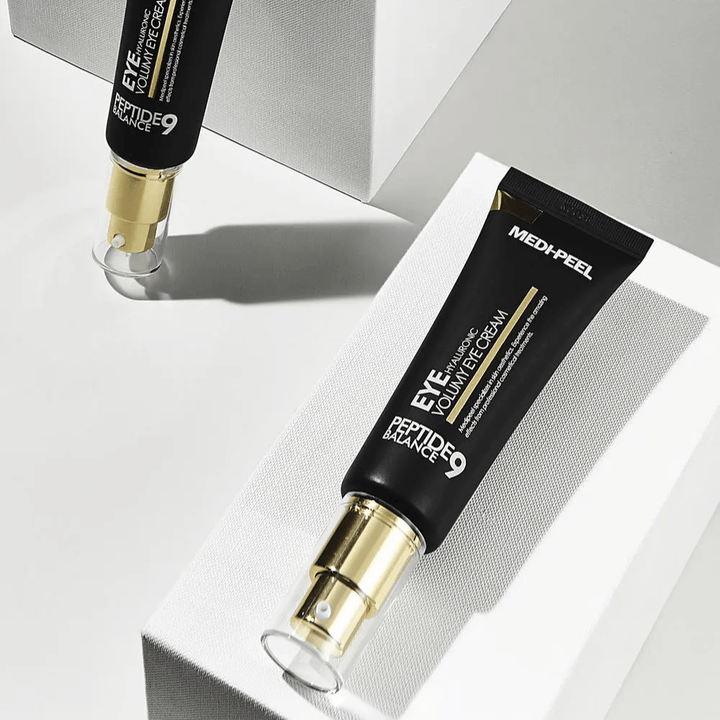 MEDI-PEEL Peptide 9 Hyaluronic Volumy Eye Cream in black and gold – Korean eye cream with peptides and hyaluronic acid that provides fuller skin and improved elasticity around the eyes.