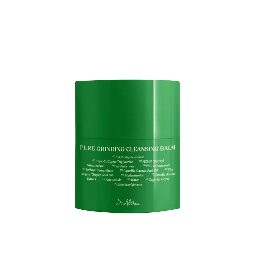 The image shows a green jar with "Pure Grinding Cleansing Balm" from Dr. Althea. The packaging is simple and sleek with white text listing key ingredients such as grapeseed oil, centella asiatica extract, and camellia seed oil. The design conveys a sense of natural and effective skincare.