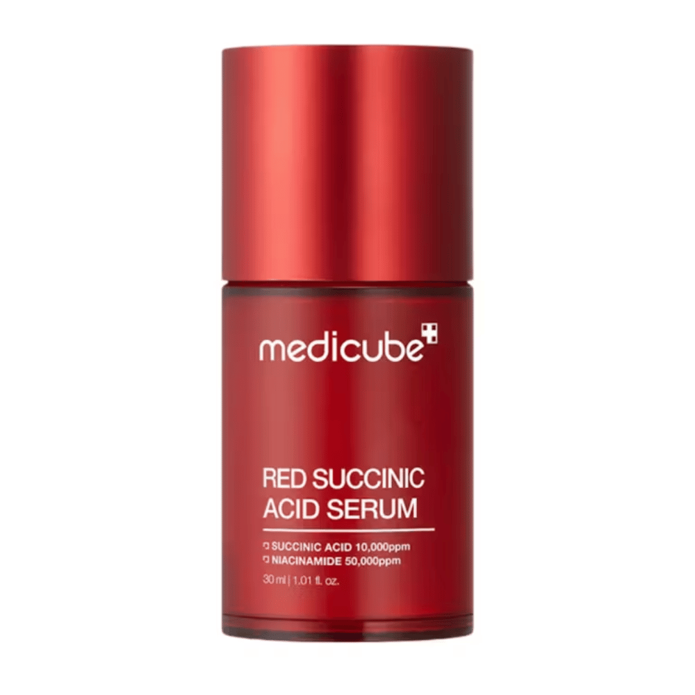 Medicube Red Succinic Acid Serum in elegant red bottle with text indicating content of succinic acid 10,000ppm and niacinamide 50,000ppm, 30 ml. Designed for acne-prone skin and pigmentation care.