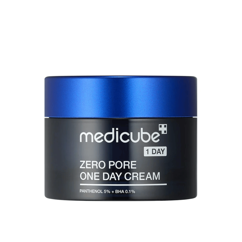 Medicube Zero Pore One Day Cream in an elegant black jar with a blue lid. Contains 5% panthenol and 0.1% BHA to reduce pore size and improve skin texture. Perfect for daily use for smoother and clearer skin.