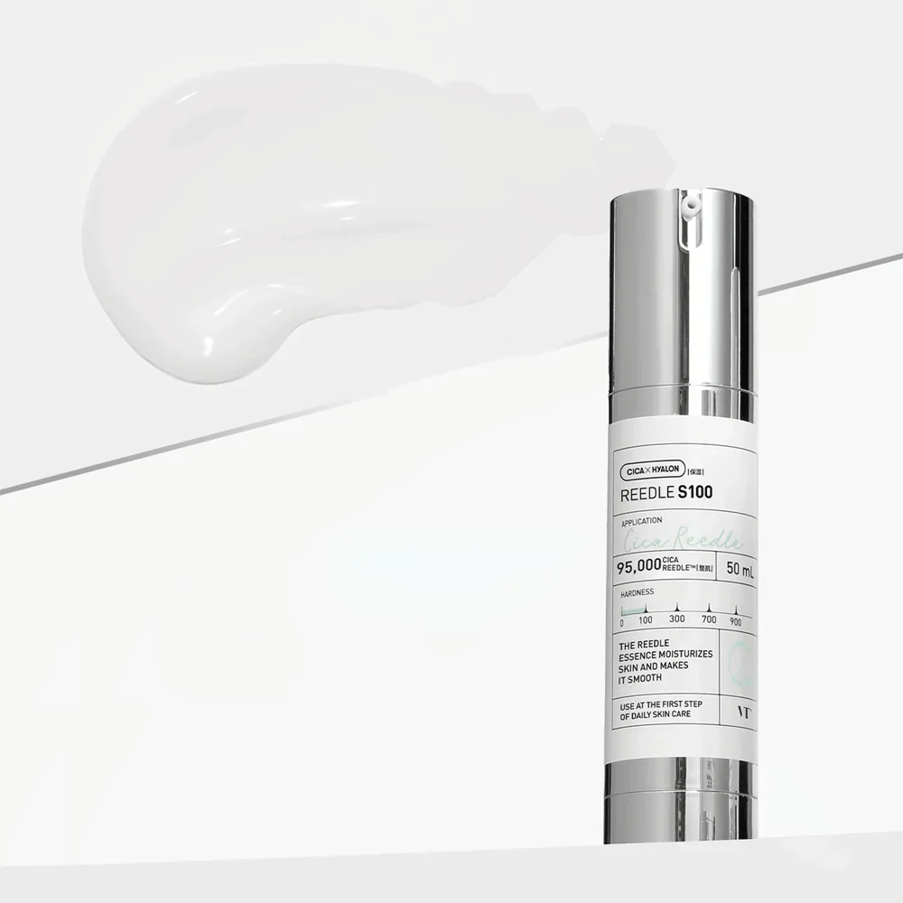 A bottle with Reedle Shot 100 stands on a white background. The product is packaged in an elegant, silver and white design with information on usage and properties. Next to the bottle lies a creamy, white substance showing the product's consistency.