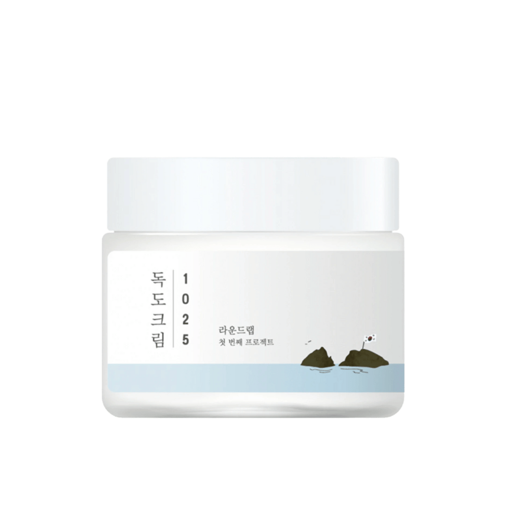 A jar with Round Lab 1025 Dokdo Cream 80ml for moisturizing on a white background.