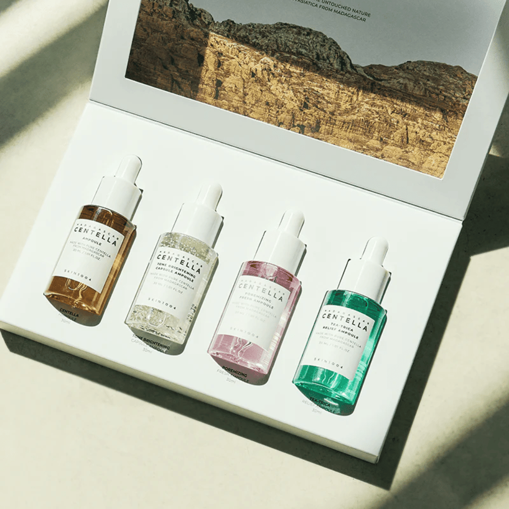 A box containing Madagascar Centella Ampoule Kit from SKIN1004, which contains three different types of skincare products for hydration and moisturizing.