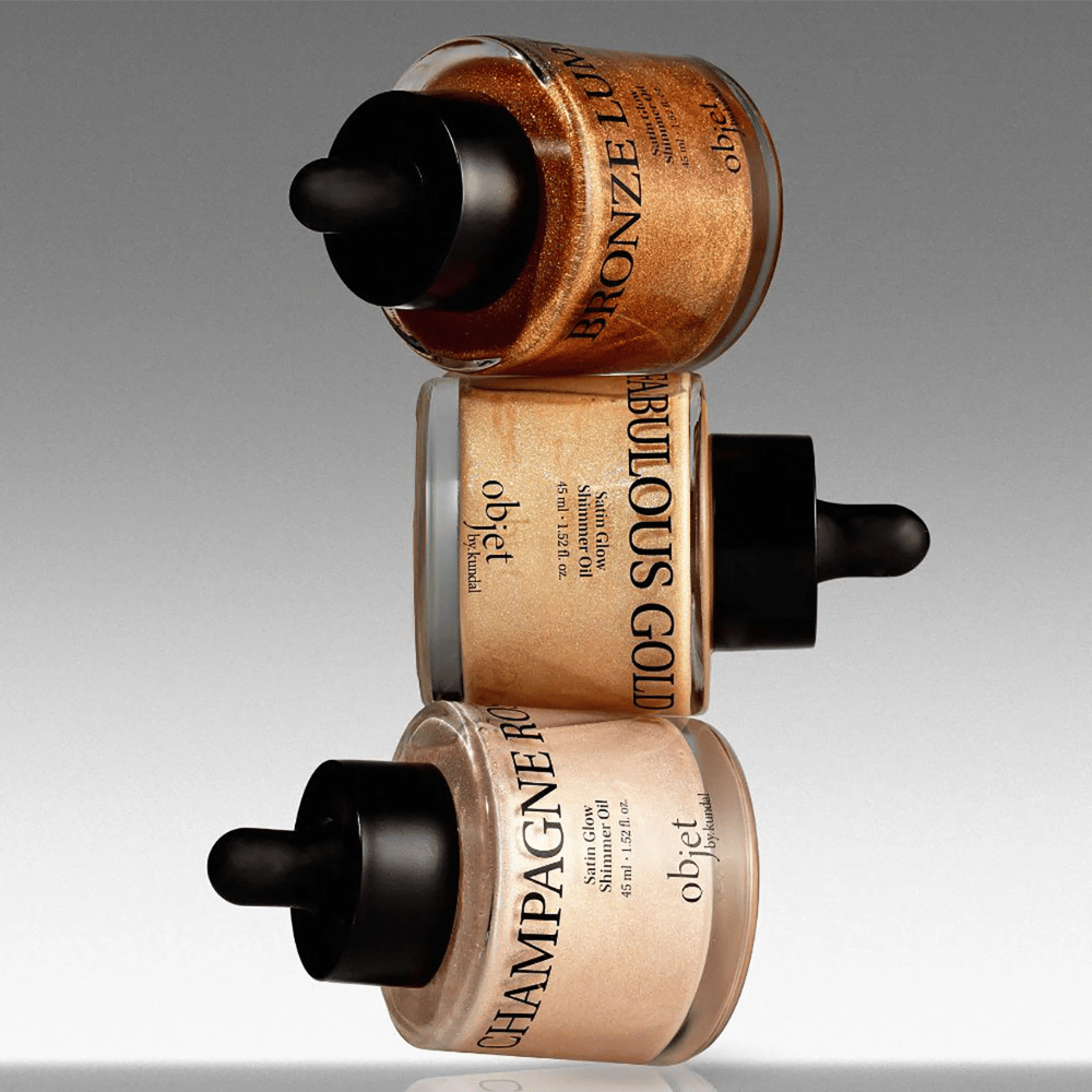 Objet by KUNDAL Satin Glow Shimmer Oil in Bronze Lumière, Fabulous Gold and Champagne Rose – shimmering body oils with a radiance-enhancing finish.