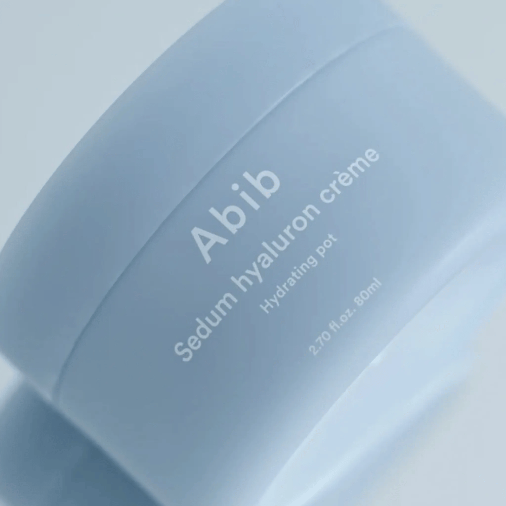 Close-up of Abib Sedum Hyaluron Crème Hydrating Pot 80 ml in a light blue jar with minimalist design against a neutral background.