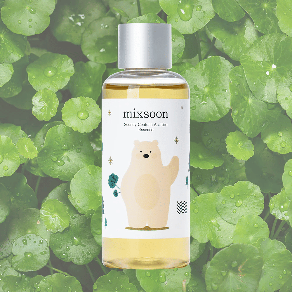 Mixsoon Soondy Centella Asiatica Essence bottle with bear illustration, against a background of green centella leaves.