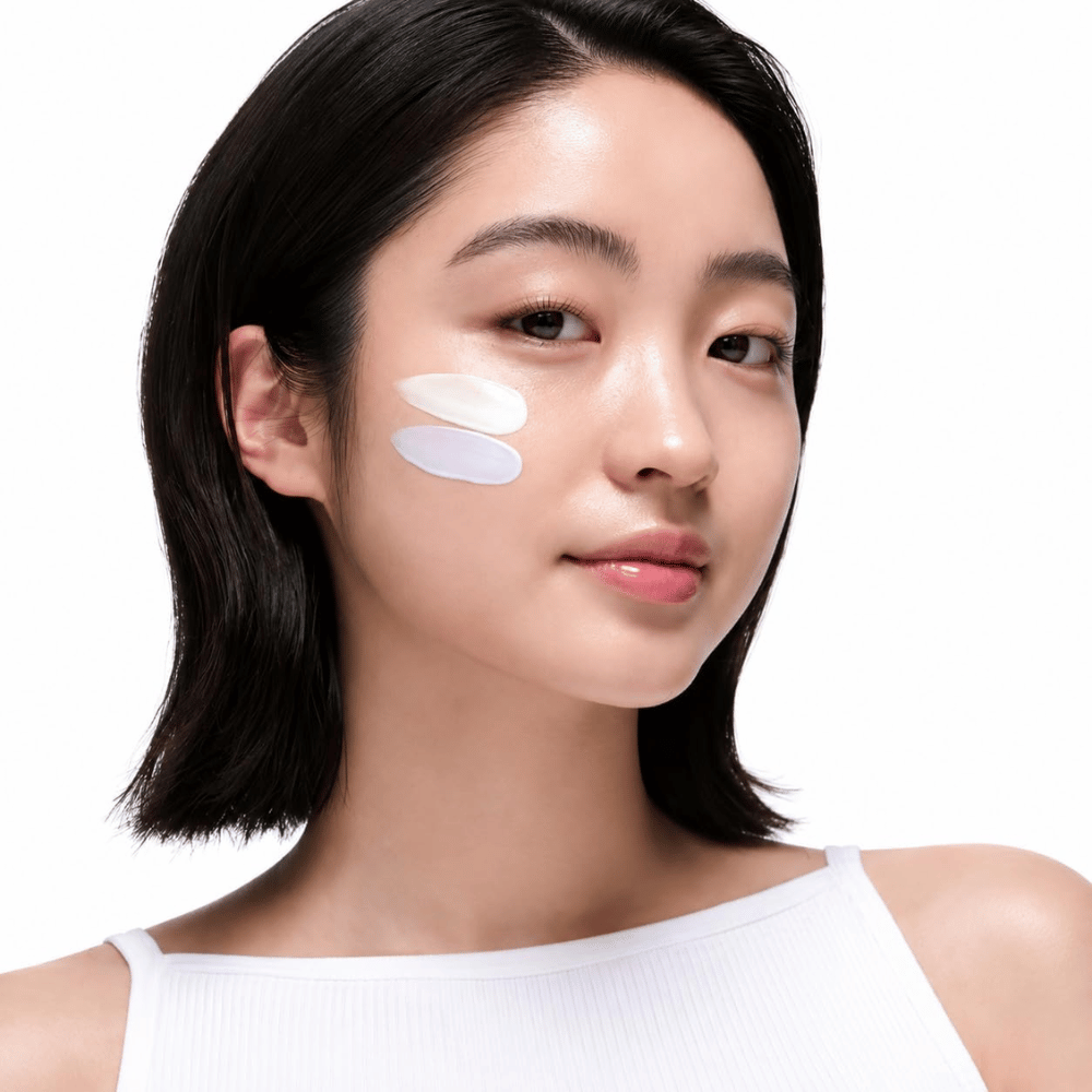 2. Beauty of Joseon Stay Fresh Color Correcting Sunscreen SPF 50 – model with green and purple color-correcting sunscreen on the cheek