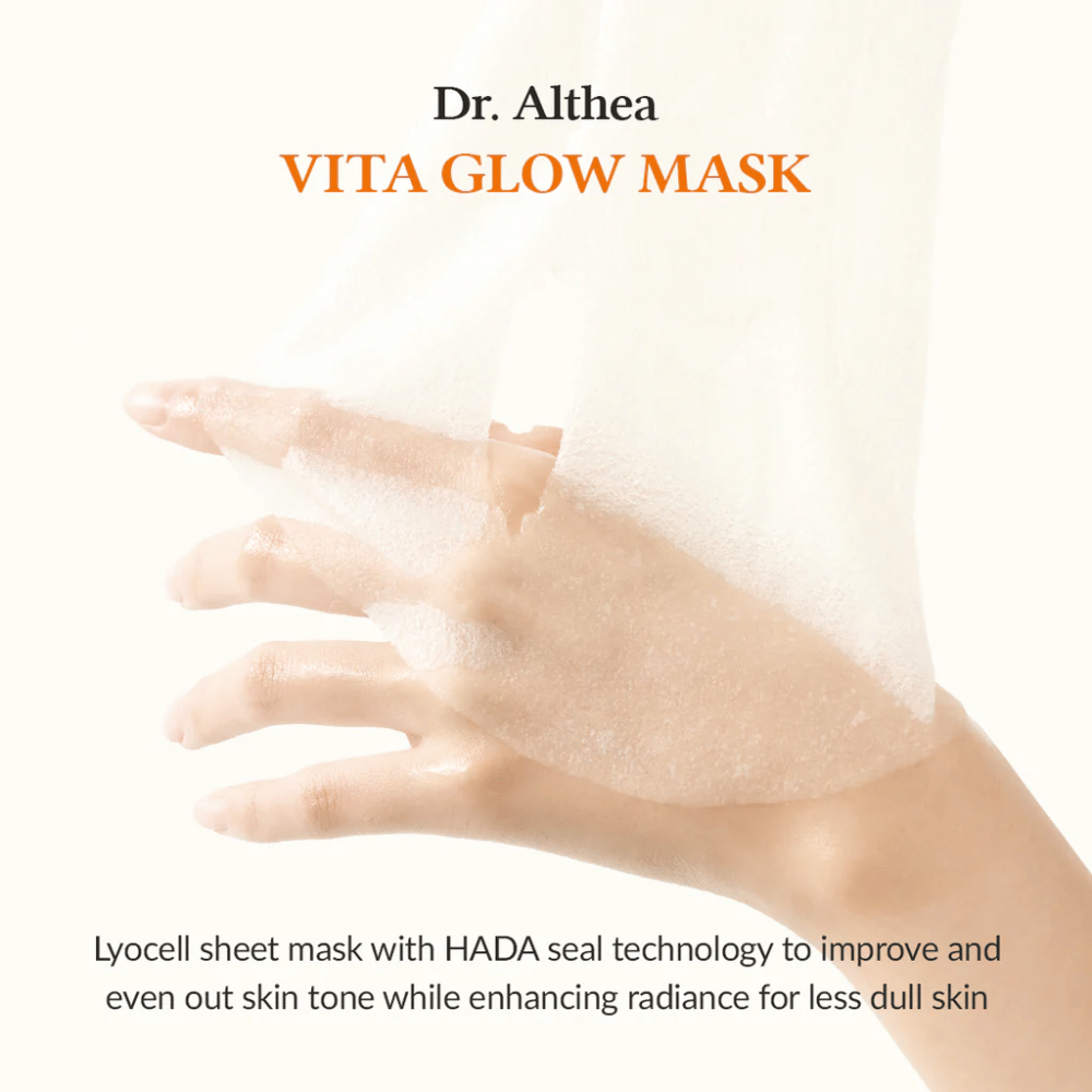 Hand holding a lyocell Sheet mask from Dr. Althea Vita Glow Mask. The mask enhances skin radiance and evenness with HADA Seal technology.