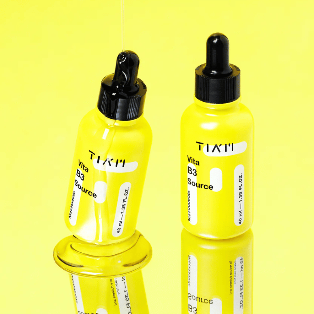 TIA'M Vita B3 Source – Two yellow bottles with radiance-enhancing niacinamide serum that evens out the skin tone and reduces pigmentation spots.