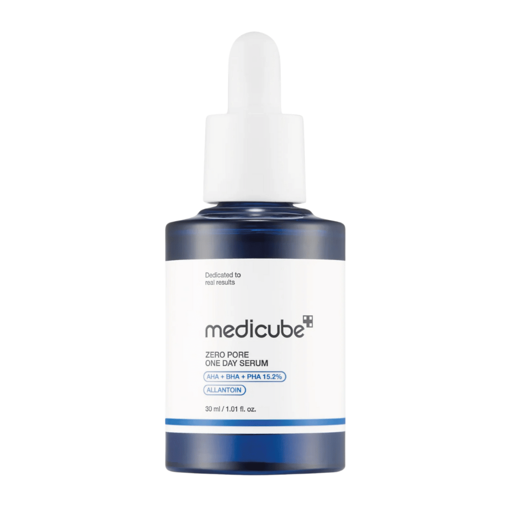 Bottle of Medicube Zero Pore One Day Serum with white label and blue details, an exfoliating product with AHA, BHA, and PHA, against a white background.