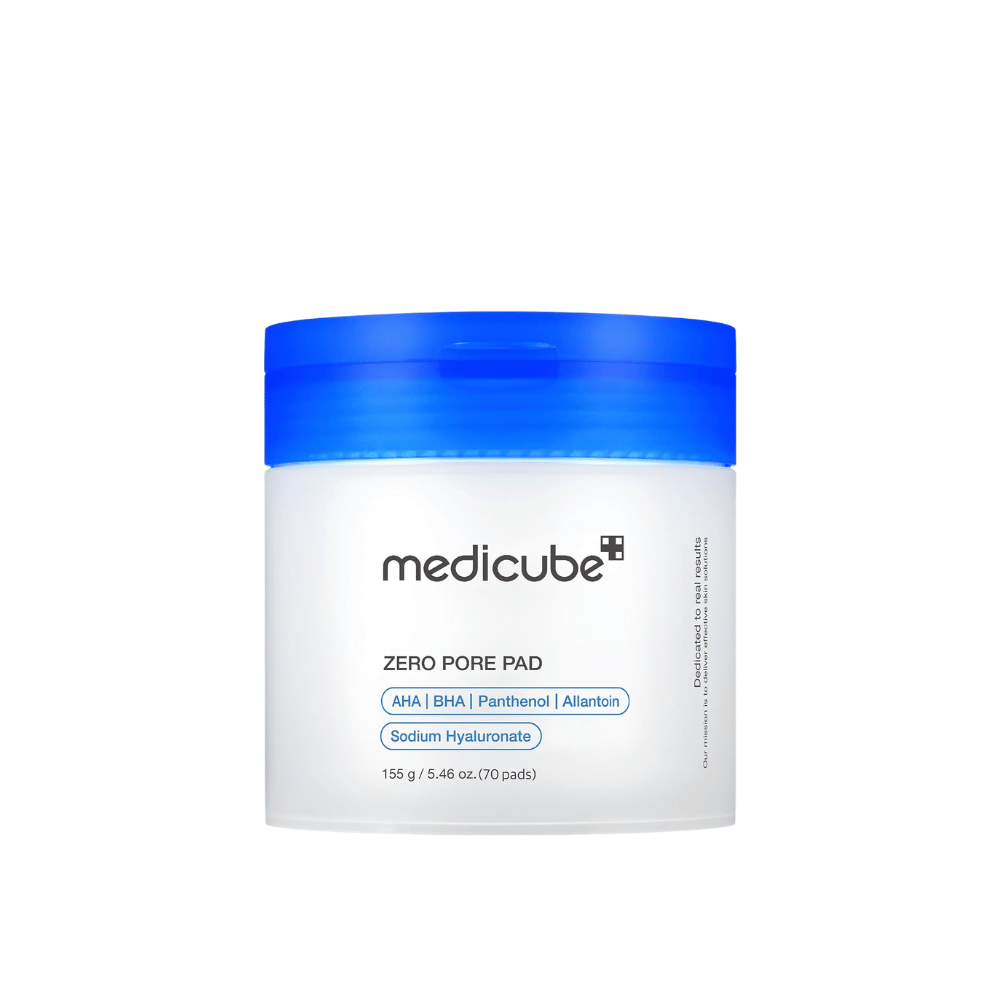 Medicube Zero Pore Pad 2.0, 70 exfoliating toner pads with AHA, BHA, and panthenol in a white jar with a blue lid against a white background.
